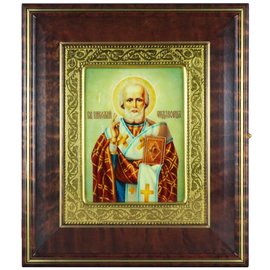 Icon "Nicholas the Wonderworker" in a kiosk and a gold frame on natural mother-of-pearl