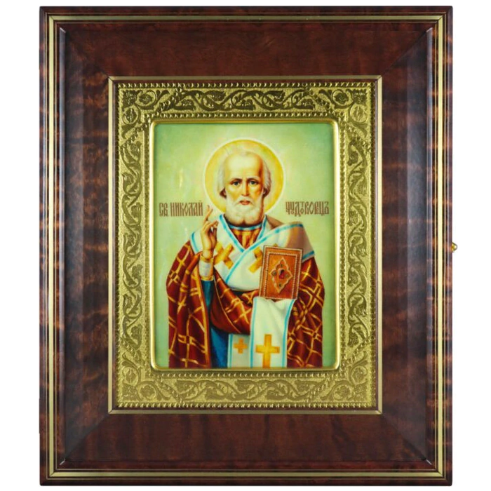 Icon "Nicholas the Wonderworker" in a kiosk and a gold frame on natural mother-of-pearl