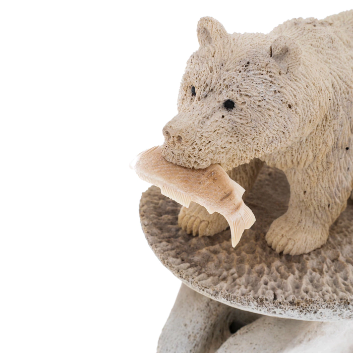 Sculpture of mammoth tusk and whale bones "Fisherman Bear"
