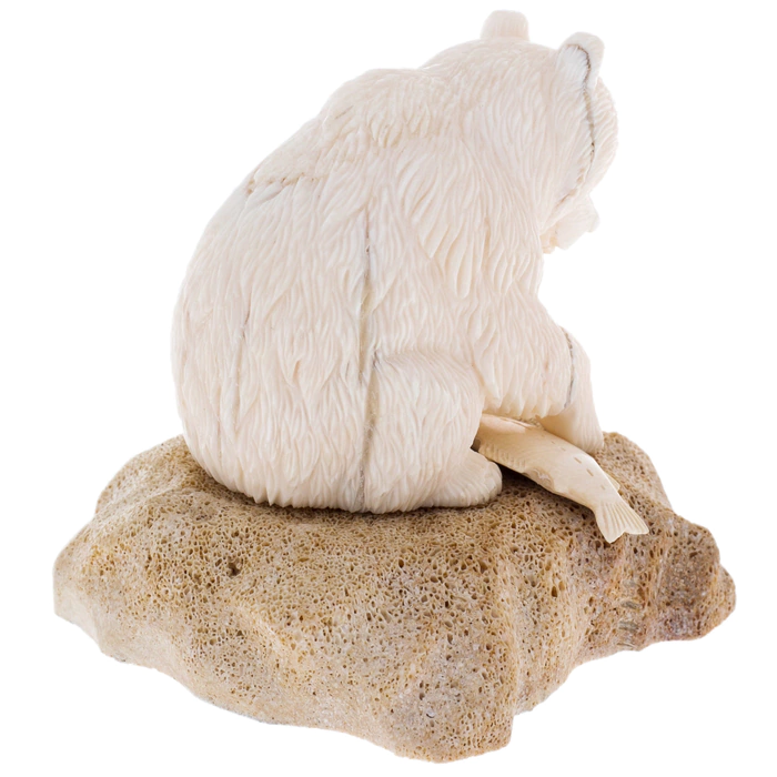 Sculpture of a walrus tusk and a whale bone "Fisherman Bear" on a stand