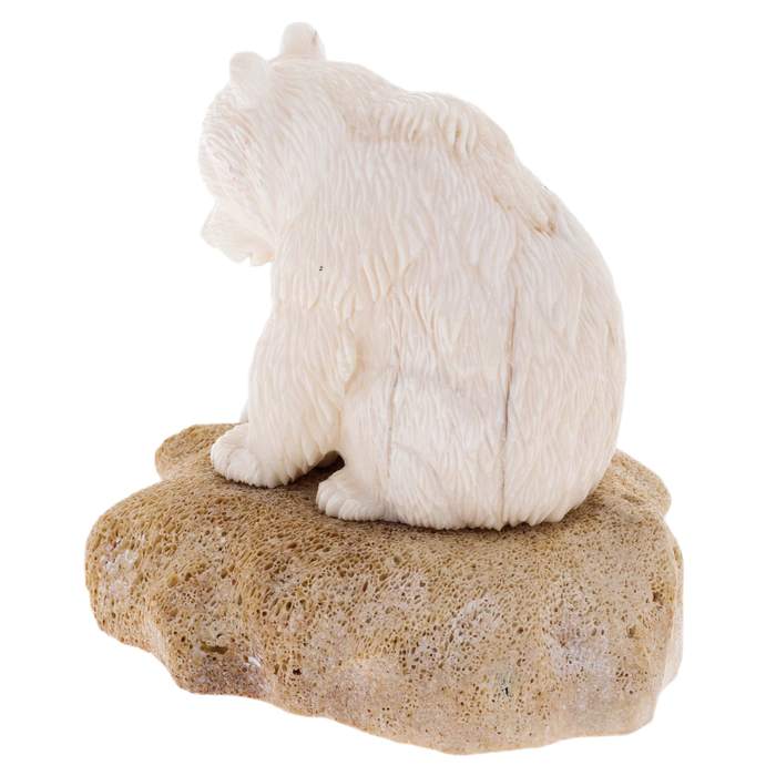 Sculpture of a walrus tusk and a whale bone "Fisherman Bear" on a stand
