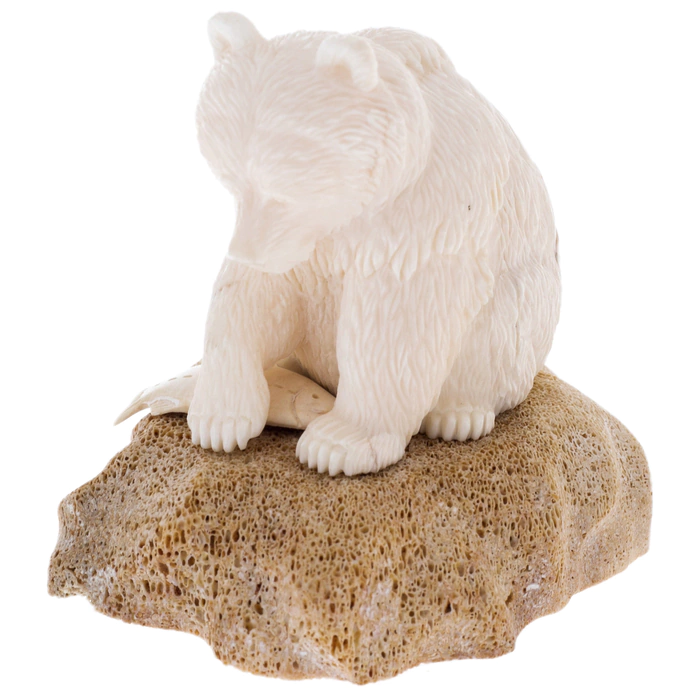 Sculpture of a walrus tusk and a whale bone "Fisherman Bear" on a stand