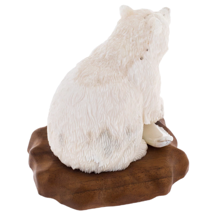 Sculpture of a walrus tusk and a tree "Mishka-rybak" on a stand