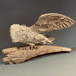 Highly artistic sculpture "Barn Owl" made of mammoth tusk