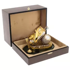 A pen holder with a watch "Golfer's Backpack" on a jade stand