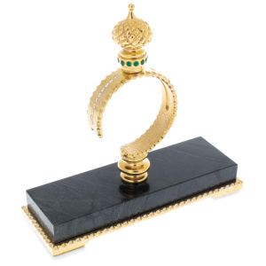 Folding knife on a stand made of green jasper