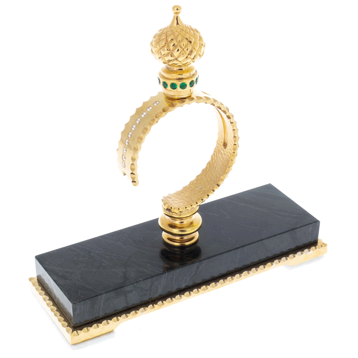 Folding knife on a stand made of green jasper