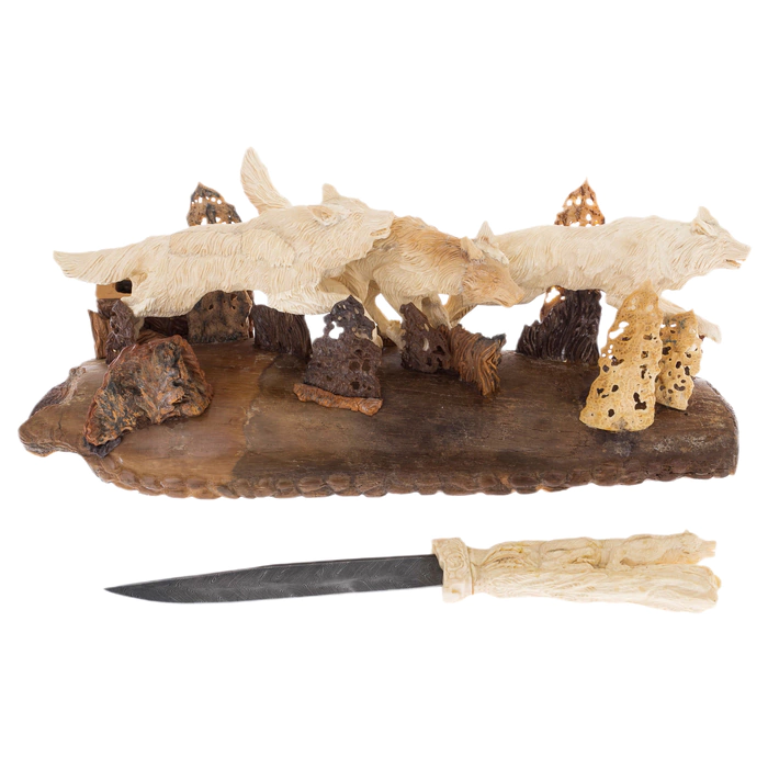 Mammoth tusk sculpture "Wolves" with a knife