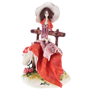 Porcelain statuette "Lady on the bench" red