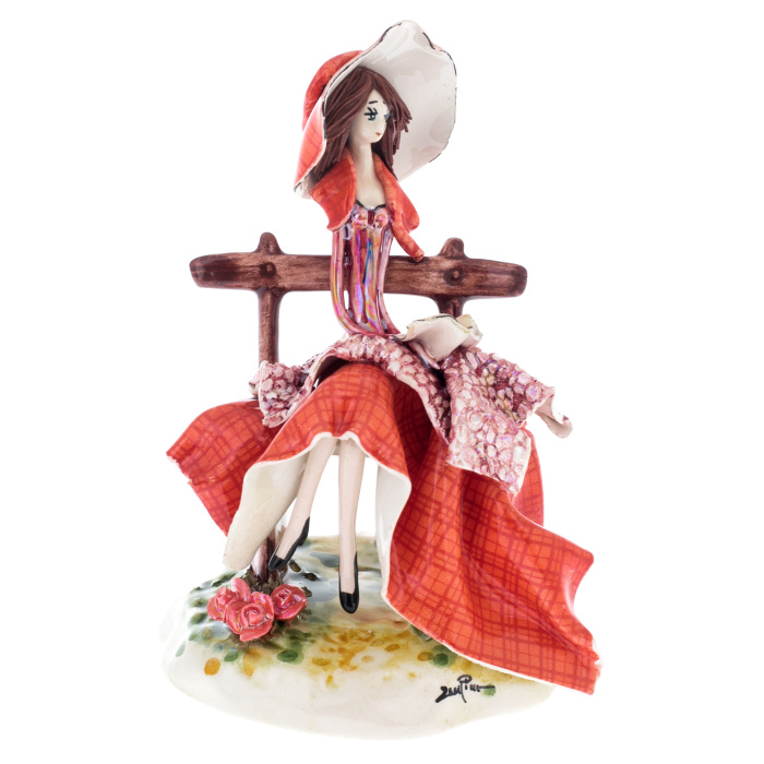 Porcelain statuette "Lady on the bench" red