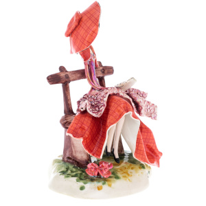 Porcelain statuette "Lady on the bench" red