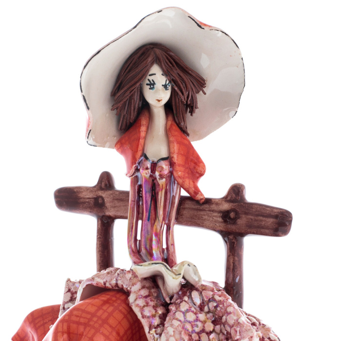 Porcelain statuette "Lady on the bench" red