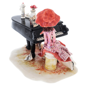 Porcelain statuette "Lady with piano" red