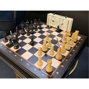 A chessboard or a clock with an autograph and a personal address of chess player and politician Anatoly Karpov.