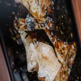 Wood and amber panel by Lucien de Sevola "The head of a lady in a medieval costume"