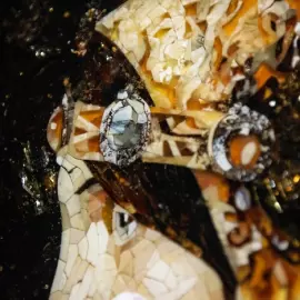 Wood and amber panel by Lucien de Sevola "The head of a lady in a medieval costume"