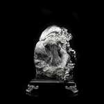 Silver sculpture "Three monkeys" on obsidian