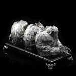 Silver sculpture "Three monkeys" on obsidian