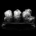 Silver sculpture "Three monkeys" on obsidian