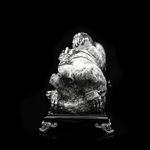 Silver sculpture "Three monkeys" on obsidian