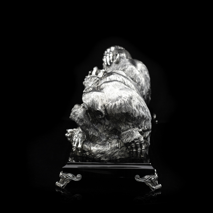 Silver sculpture "Three monkeys" on obsidian