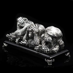 Silver sculpture "Three monkeys" on obsidian