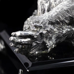 Silver sculpture "Three monkeys" on obsidian