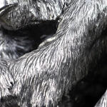 Silver sculpture "Three monkeys" on obsidian