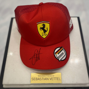 Autographed cap of racing driver Sebastian Vettel, white marble