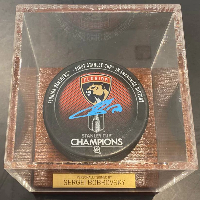 An autographed puck by hockey player Sergei Bobrovsky