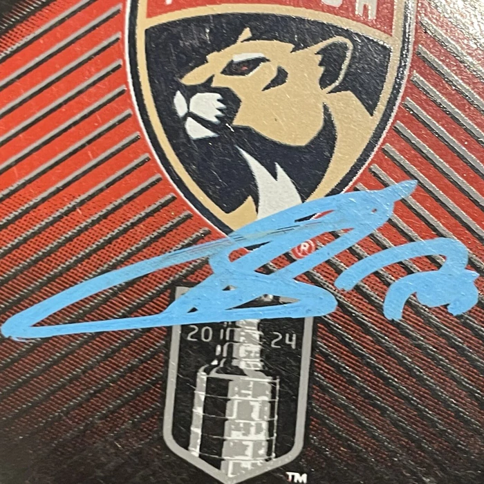 An autographed puck by hockey player Sergei Bobrovsky