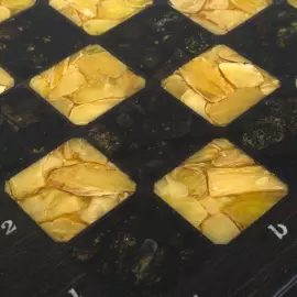 Chess chest made of stained oak and amber