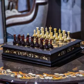 Chess chest made of stained oak and amber