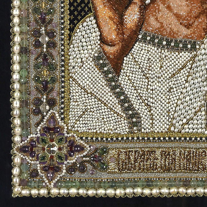 The embroidered icon "The Lord Almighty" in an antique frame and a kiosk