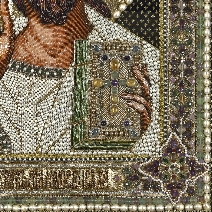 The embroidered icon "The Lord Almighty" in an antique frame and a kiosk