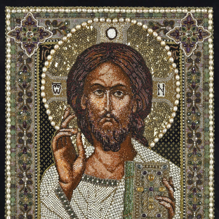 The embroidered icon "The Lord Almighty" in an antique frame and a kiosk