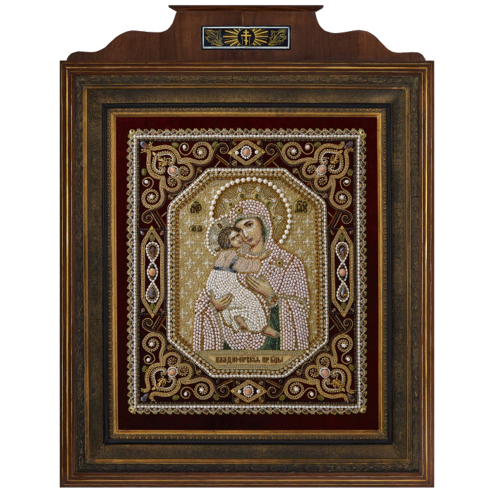 The embroidered icon "Our Lady of Vladimir" in a frame and a kiosk