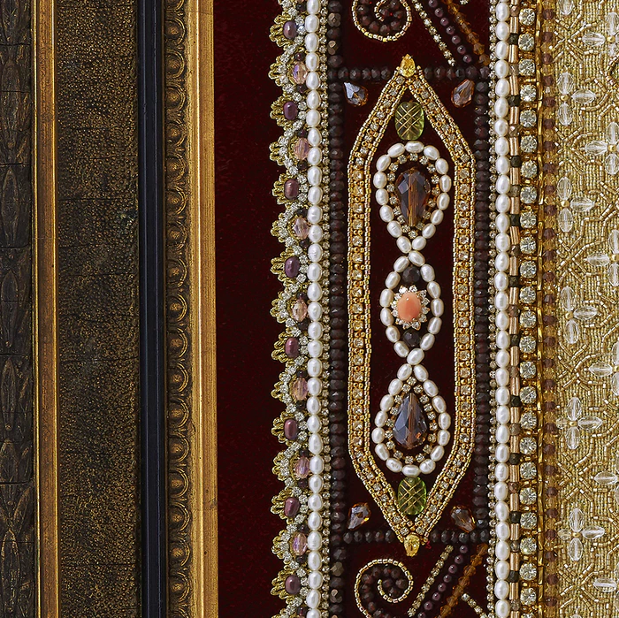 The embroidered icon "Our Lady of Vladimir" in a frame and a kiosk
