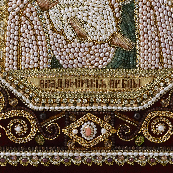 The embroidered icon "Our Lady of Vladimir" in a frame and a kiosk