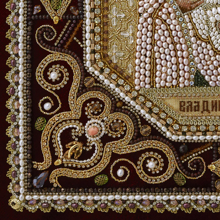 The embroidered icon "Our Lady of Vladimir" in a frame and a kiosk