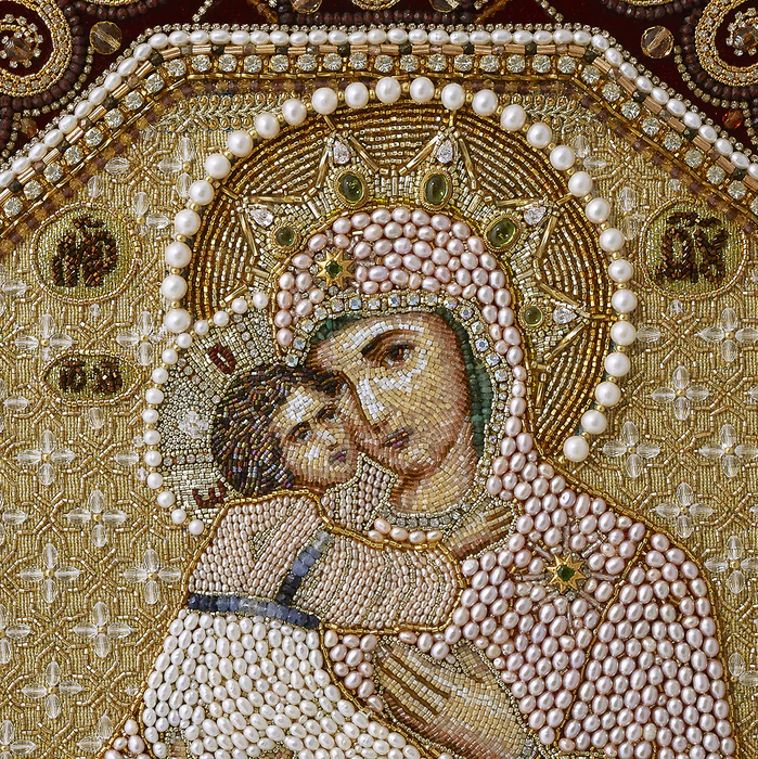 The embroidered icon "Our Lady of Vladimir" in a frame and a kiosk