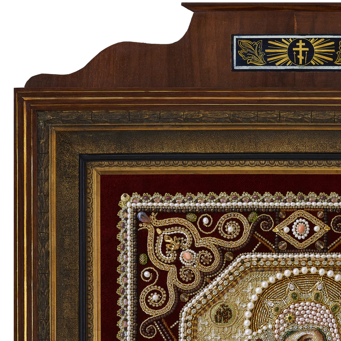 The embroidered icon "Our Lady of Vladimir" in a frame and a kiosk