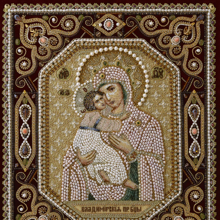 The embroidered icon "Our Lady of Vladimir" in a frame and a kiosk