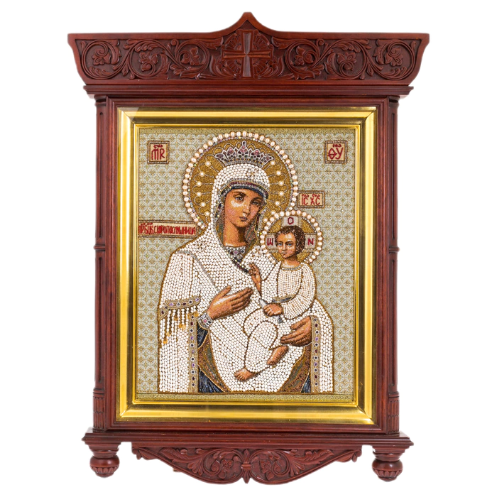The embroidered icon of the Mother of God in an antique kiosk