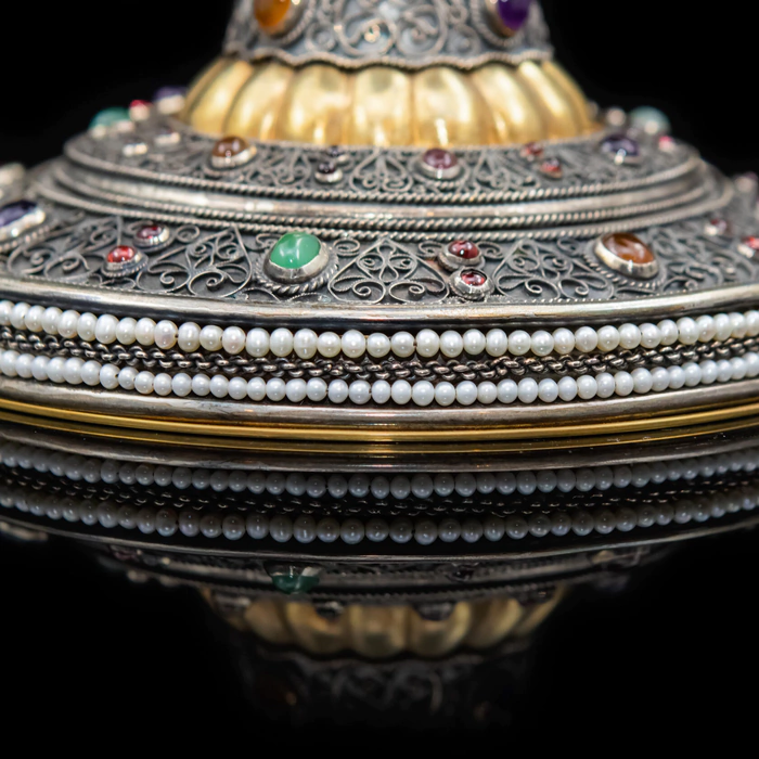 A unique bowl made of silver, gemstones and pearls