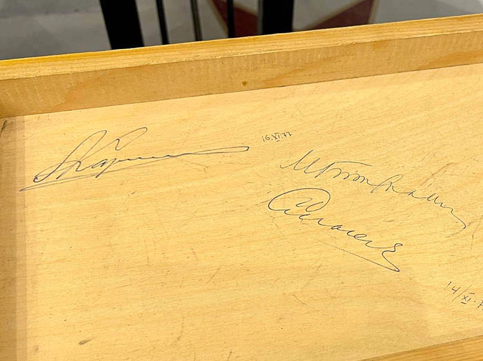 Part of the chessboard with autographs of chess players: Mikhail Botvinnik, Anatoly Karpov, Vasily Smyslov