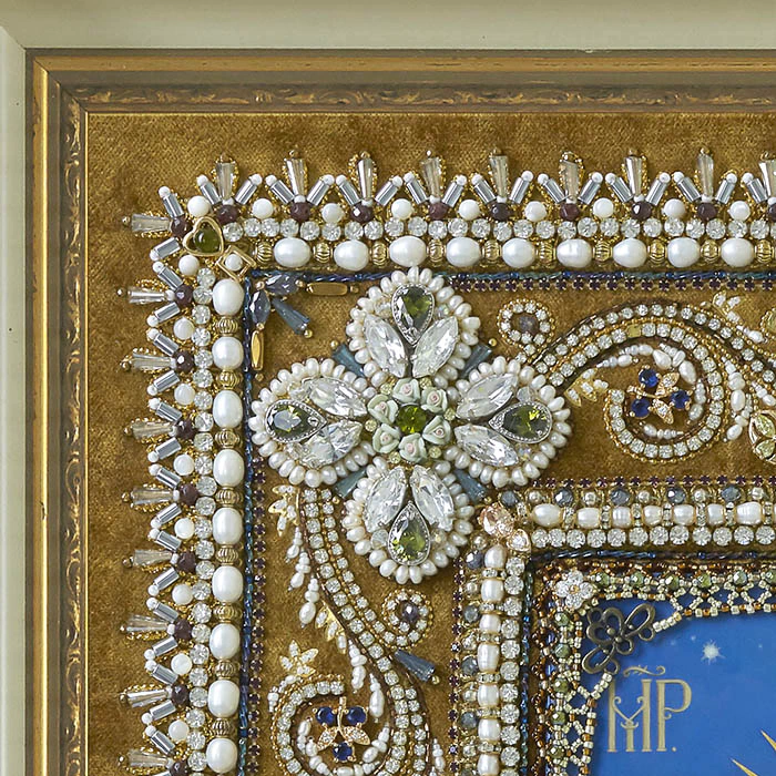 The embroidered icon "Our Lady of Ostrobram" in a frame