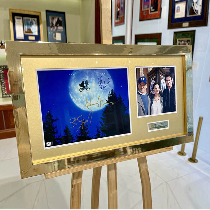 Autographed photo of actors Thomas Henry, Drew Barrymore and film director Steven Spielberg