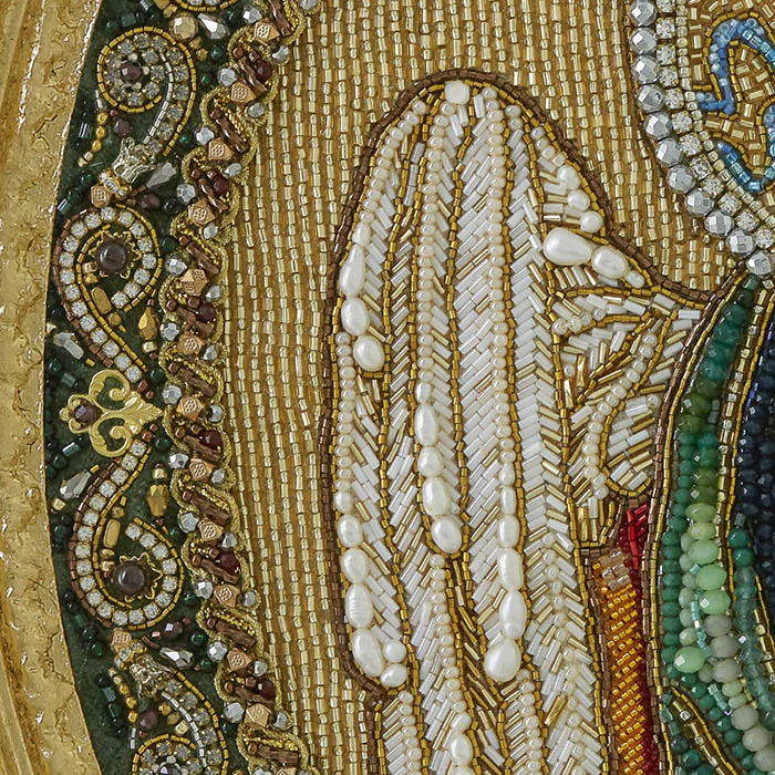 The embroidered icon of the Annunciation. Archangel Gabriel" in a frame