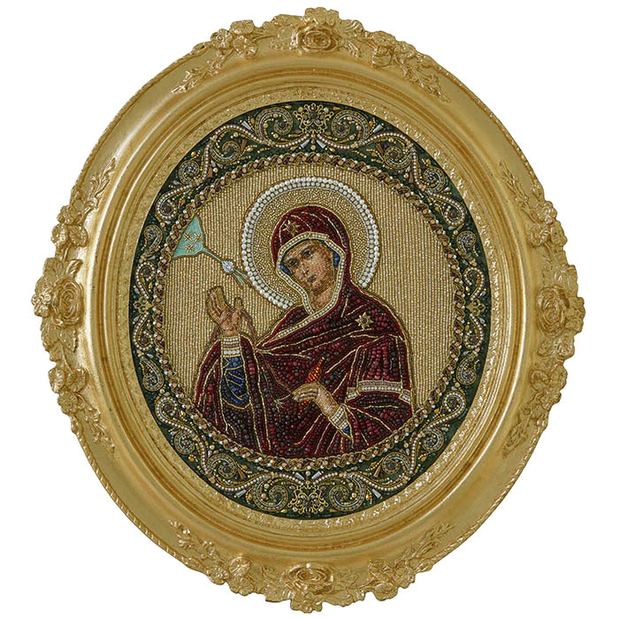 The embroidered icon of the Annunciation. The Virgin" in a frame